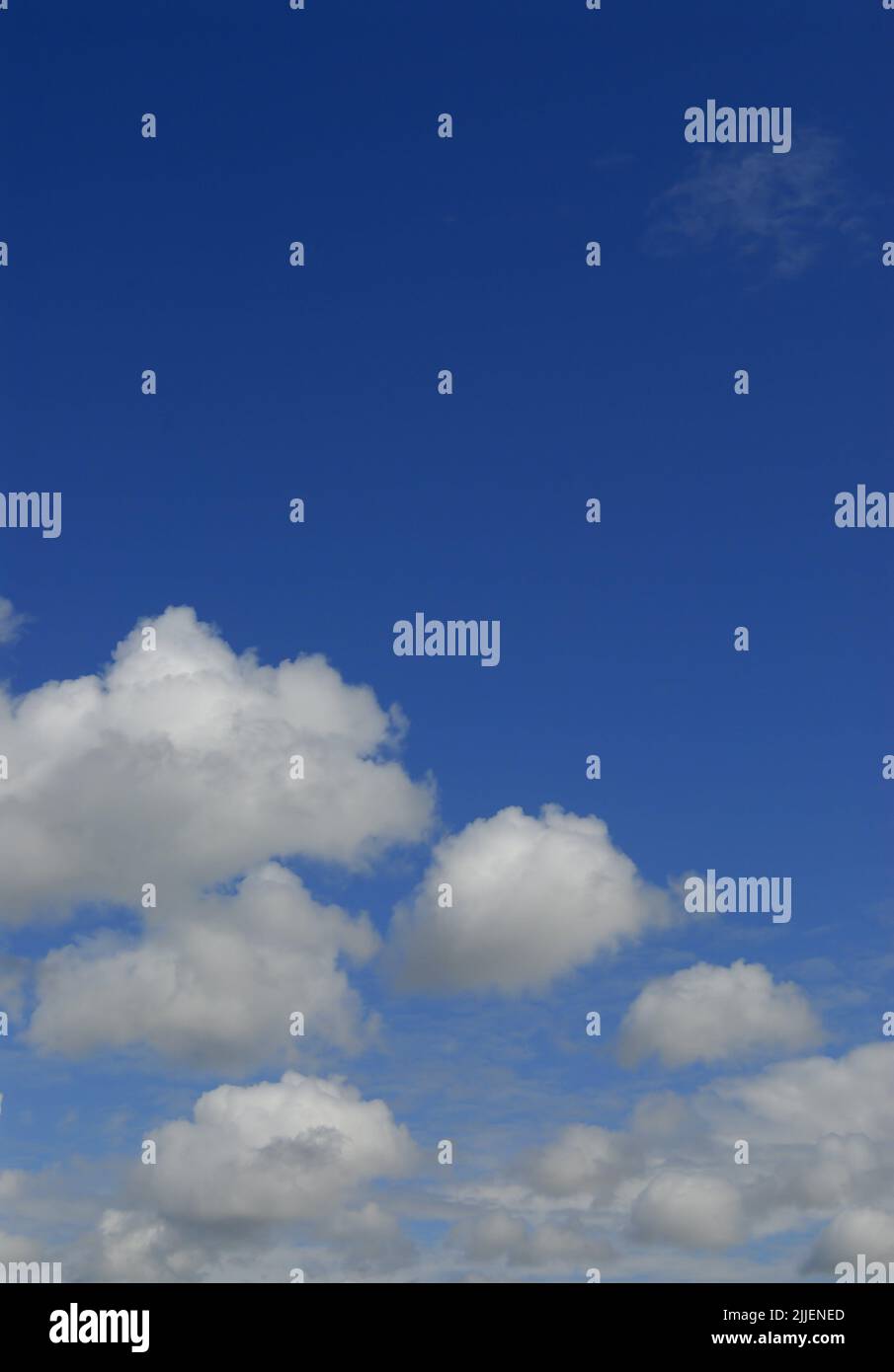 perfect blue sky partly covered with cumulus clouds on a sunny morning Stock Photo