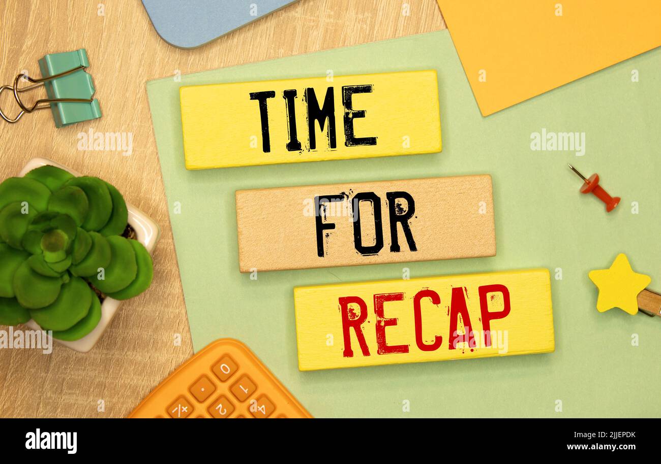 Wooden cubes stacked on top of each other make up the TIME FOR RECAP