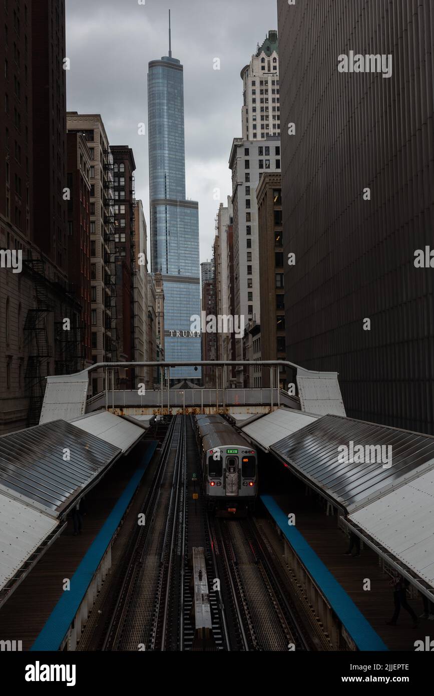 Chicago : October 10, 2018, Train on elevated tracks within buildings at the Loop, Glass and Steel bridge between buildings - Chicago City Center - Ch Stock Photo