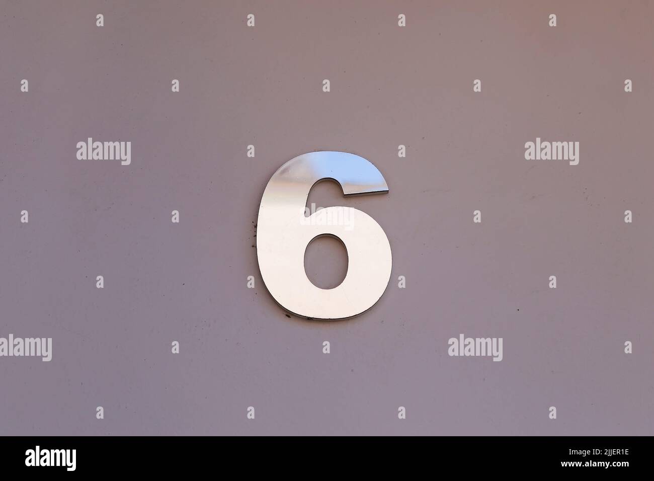 number six in metallic plate format, with copy space and gray tone - 6 Stock Photo