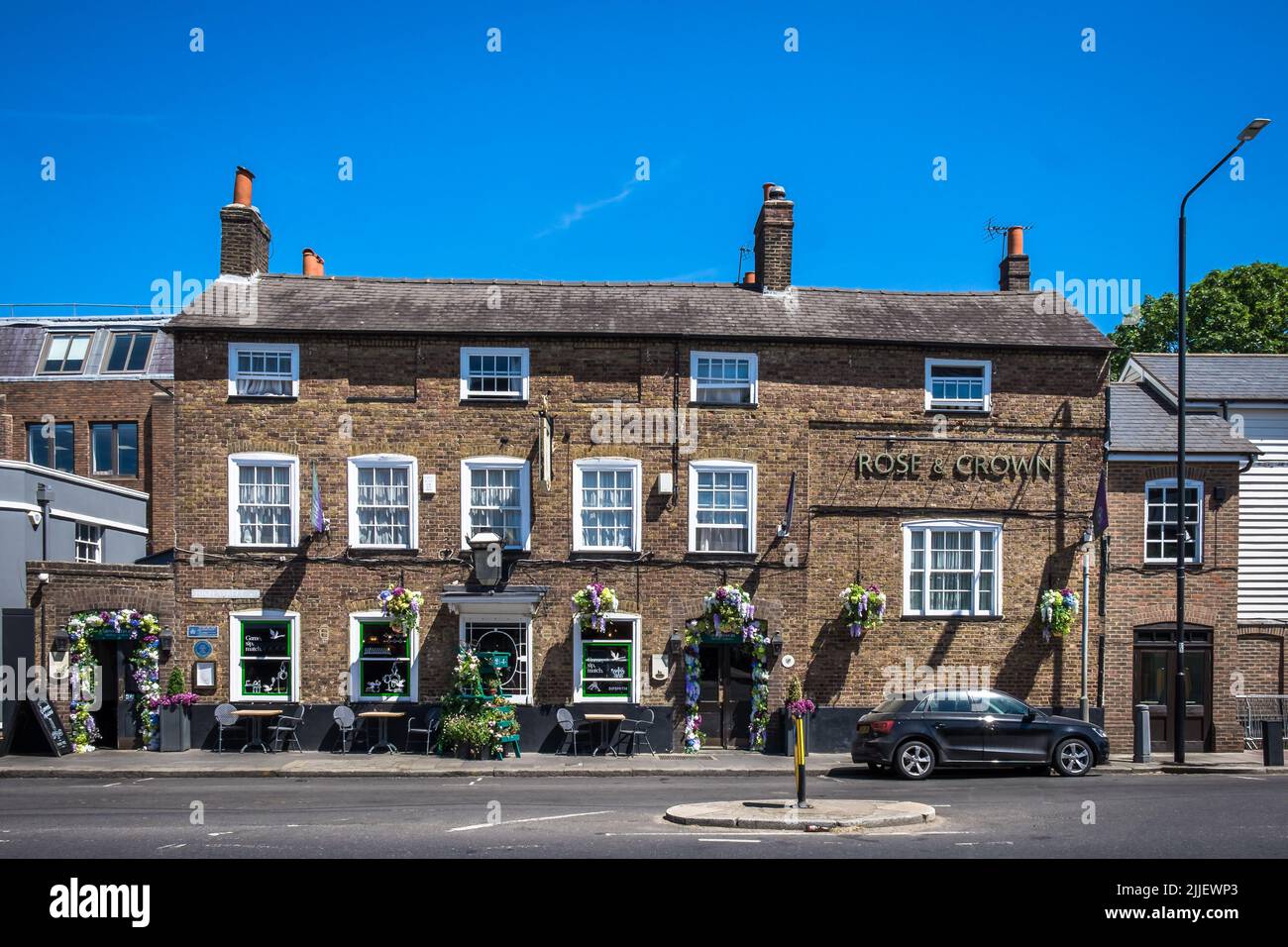 London, United Kingdom, July 2022, view of the exterior of the Rose and Crown, a pub in Wimbledon Village decorated for the time of the tournament. Stock Photo