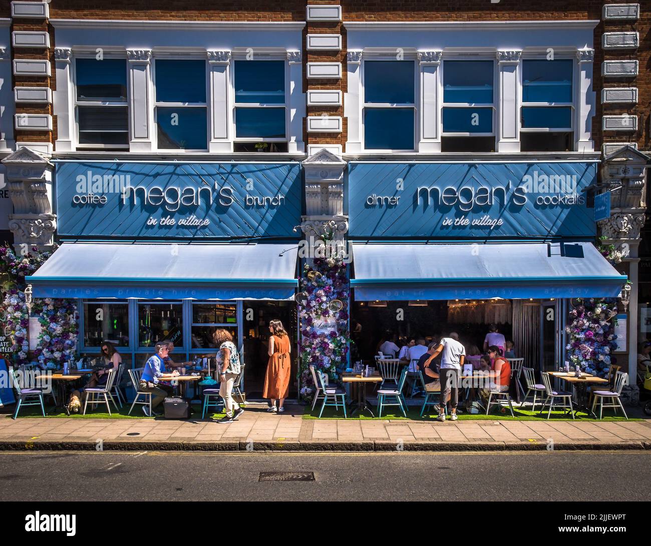 London, UK, July 2022, view of Megan's in the Village, a restaurant in Wimbledon Village decorated for the time of the tournament. Stock Photo