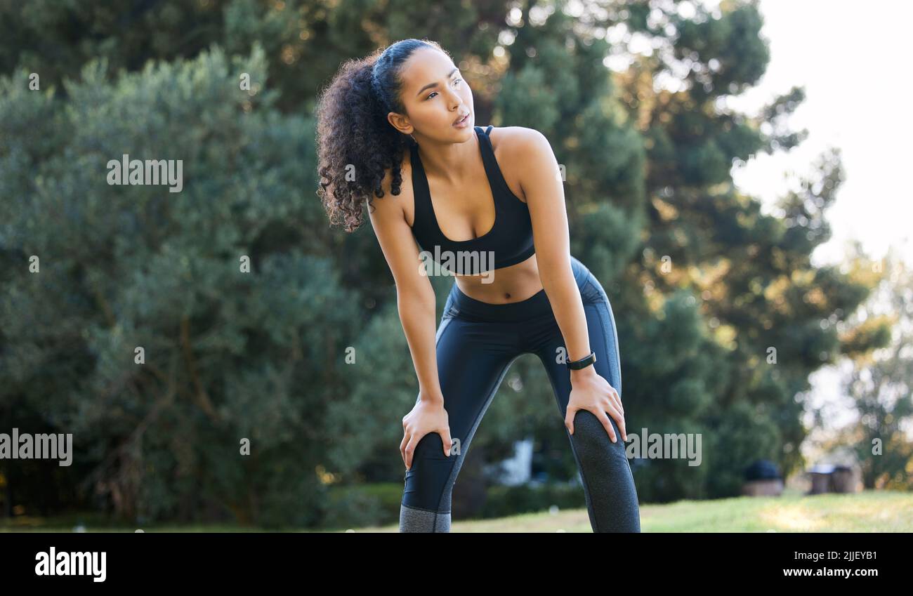You have to do whatever it takes. a sporty young woman catching her