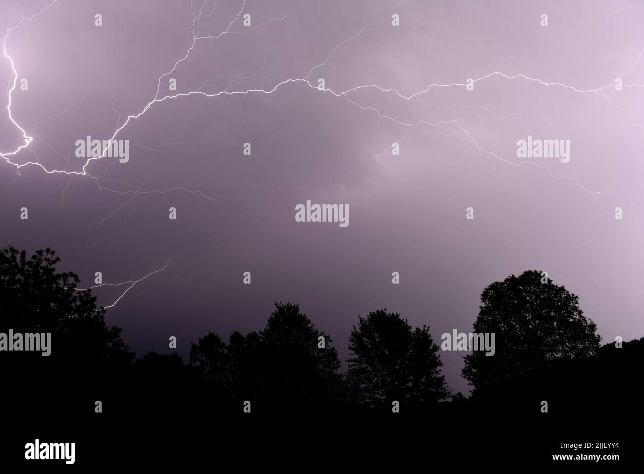 Early summer lightning storm breaks across the sky in Arkansas Stock Photo
