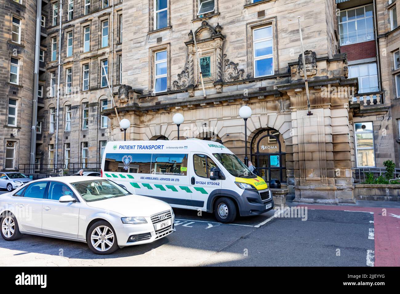 Ambulance parked outside main entrance to Glasgow Royal Infirmary hospital in Glasgow,Scotland,UK,Europe Stock Photo
