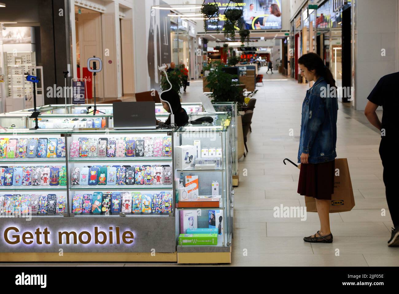 Saint Petersburg, Russia. 25th July, 2022. A visitor chooses stores for