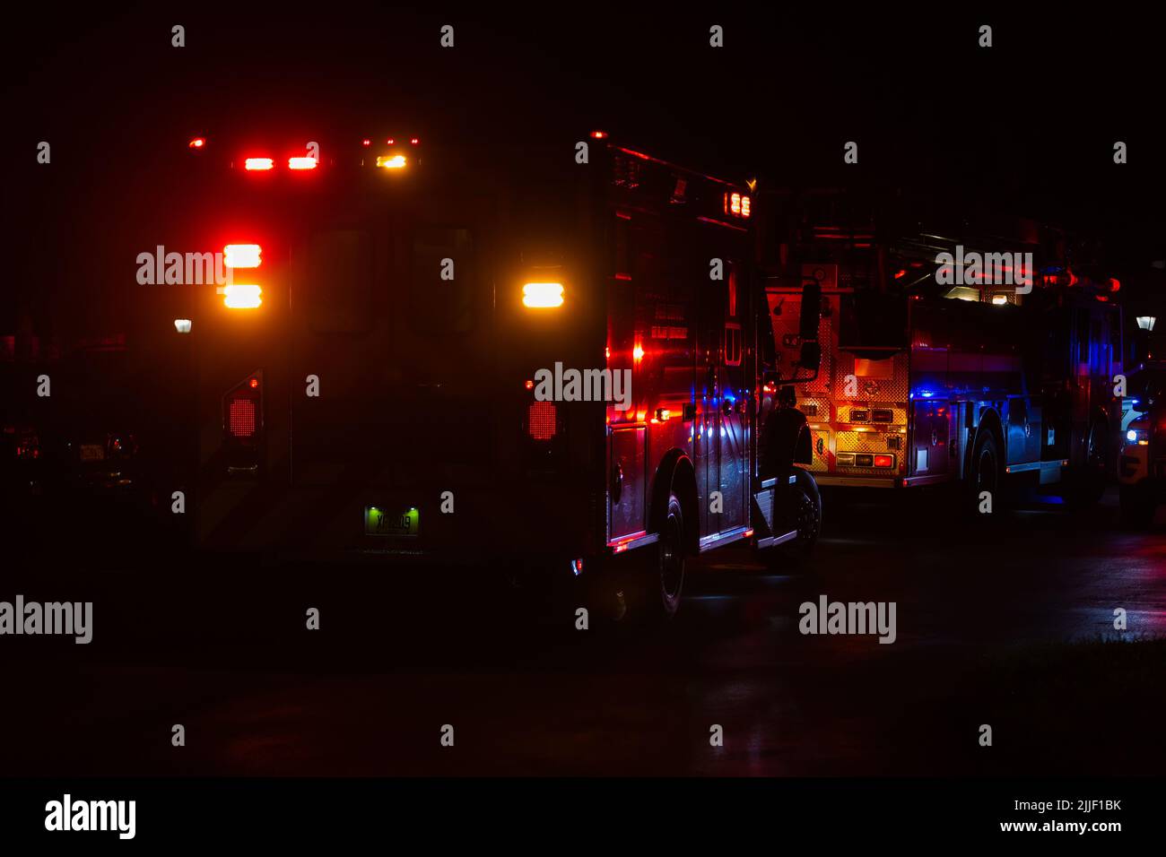 Night accident, fire and police department on duty at night time. Heavy night job. Emergency rescue. Stock Photo