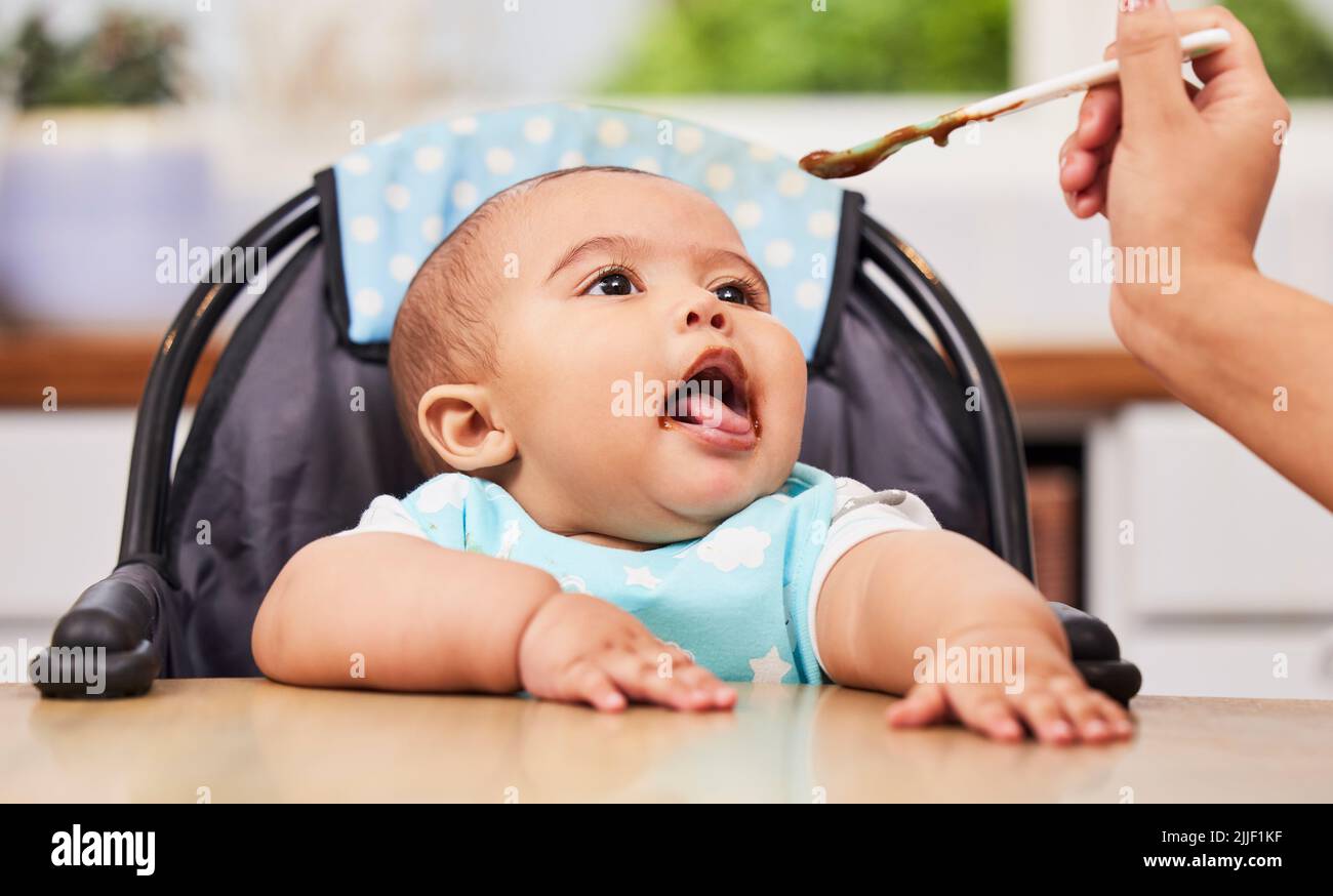 mother feeding her baby girl by spoon Stock Photo - Alamy