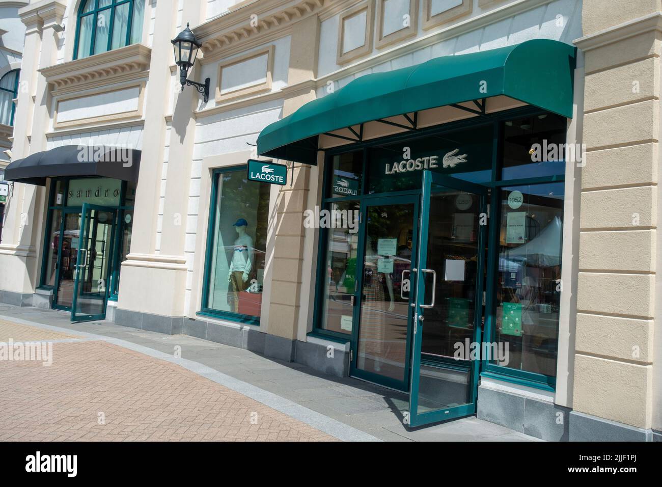 Lacoste Store Entrance in McArthur Glen Designer Outlet Stock Photo - Alamy