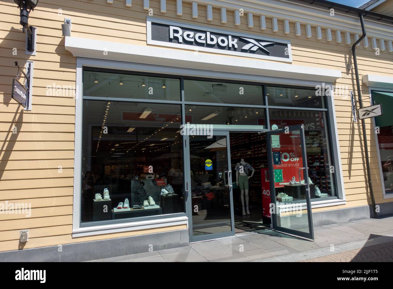 Reebok Store Entrance in McArthur Glen Designer Outlet Stock Photo - Alamy