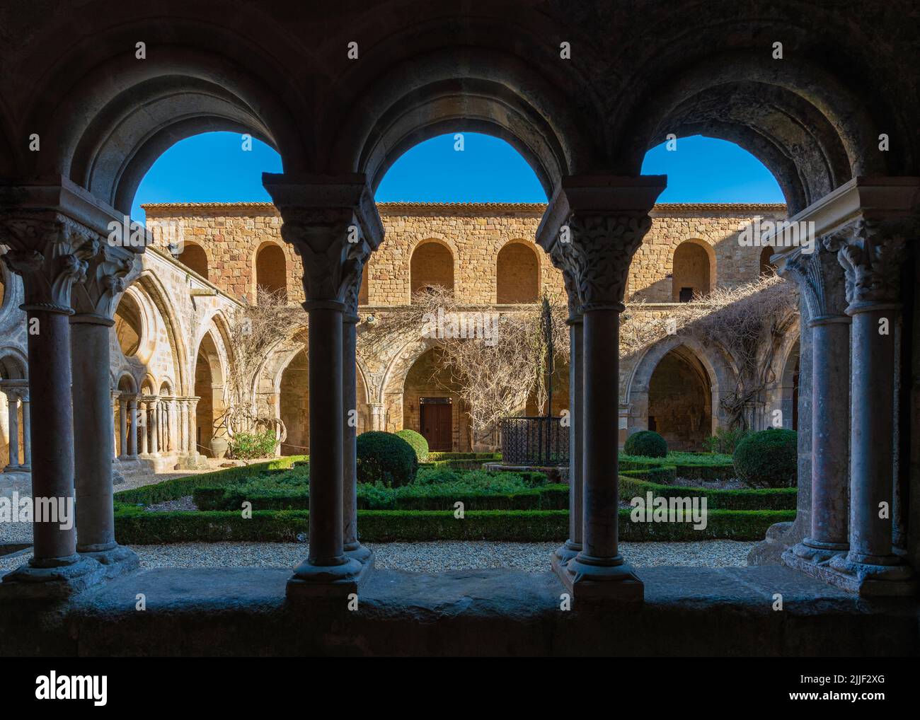 Columns of the cloister of the Frontfroide Abbey, France, taken on a sunny winter afternoon with no people Stock Photo