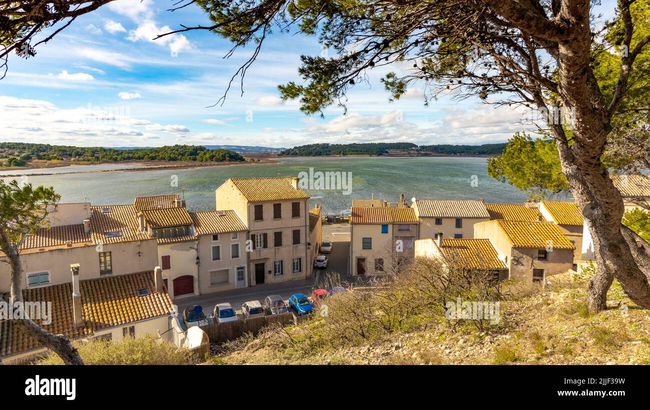 Old houses of the village of Gruissan with a lake in the background taken from a hill on a sunny winter afternoon with no people Stock Photo