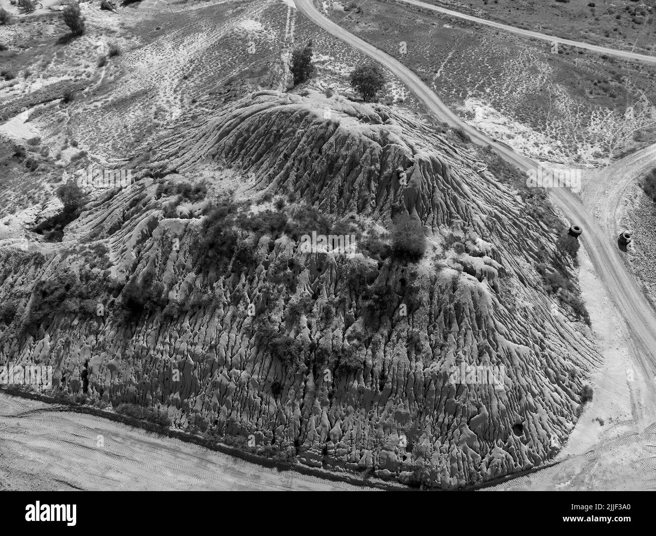 Large pile of dirt in monotone - Rubyvale underground sapphire mine