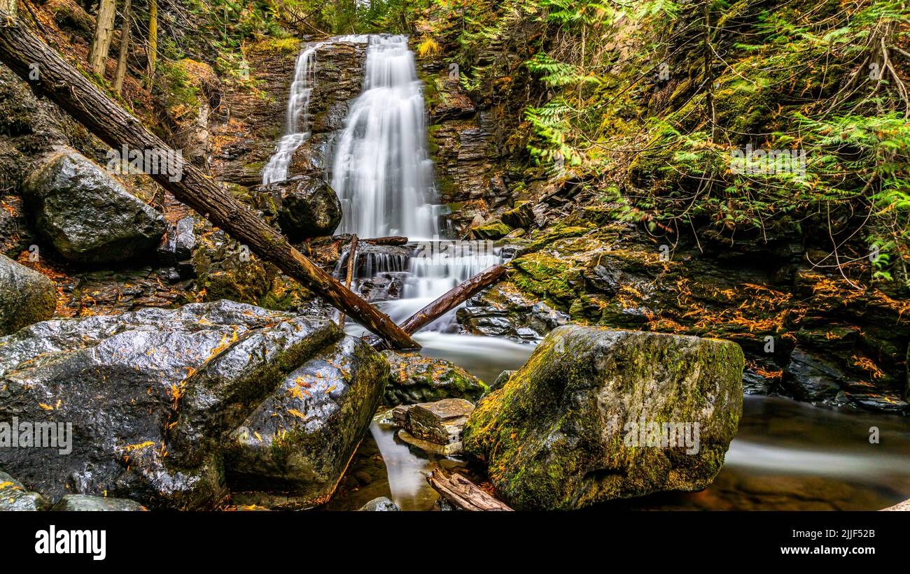 Fall Colors at Long Exposure of Whitecroft Falls on Mcgillivray Creek near the town of Whitecroft in British Columbia, Canada Stock Photo