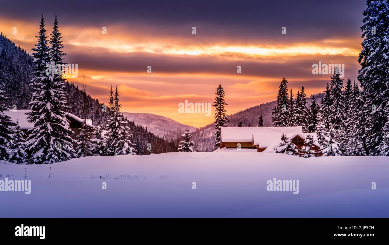 Sunset over a Snow Landscape at Sun Peaks ski resort in the Shuswap Highlands of British Columbia, Canada Stock Photo