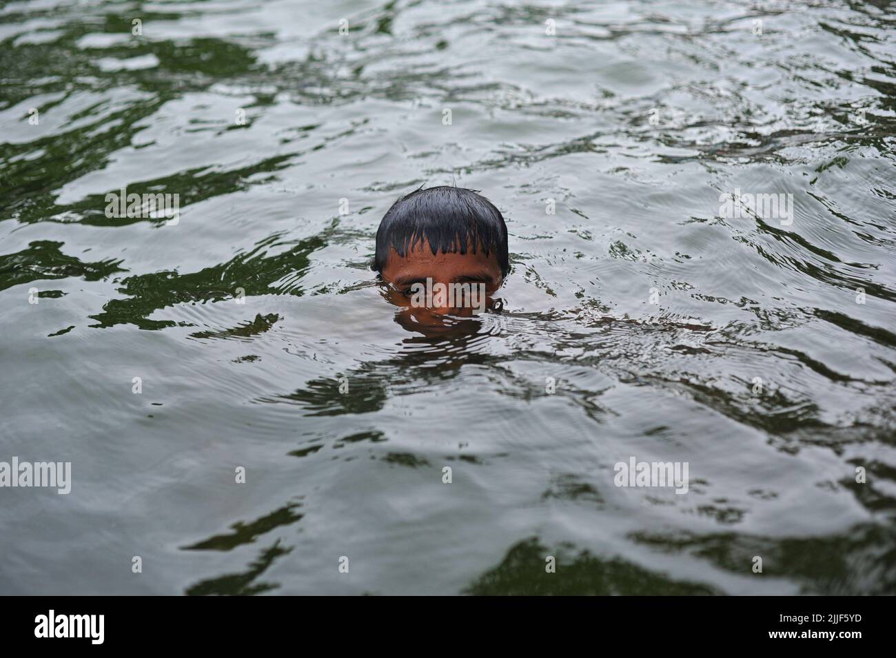 Children swimming in a pond. Drowning is one of the leading causes of