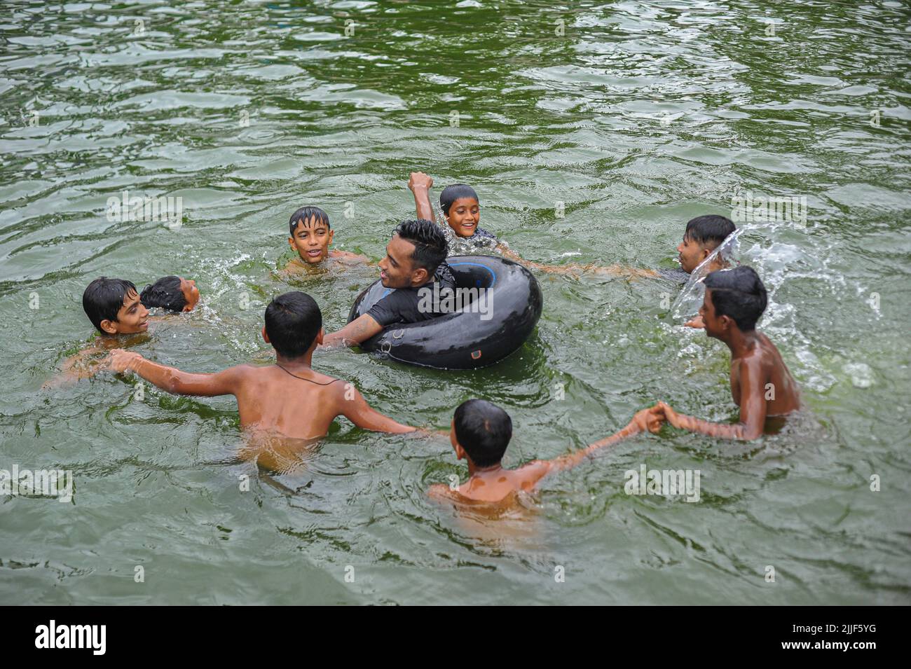A young boy is learning to swim in a Pond.Drowning is one of the