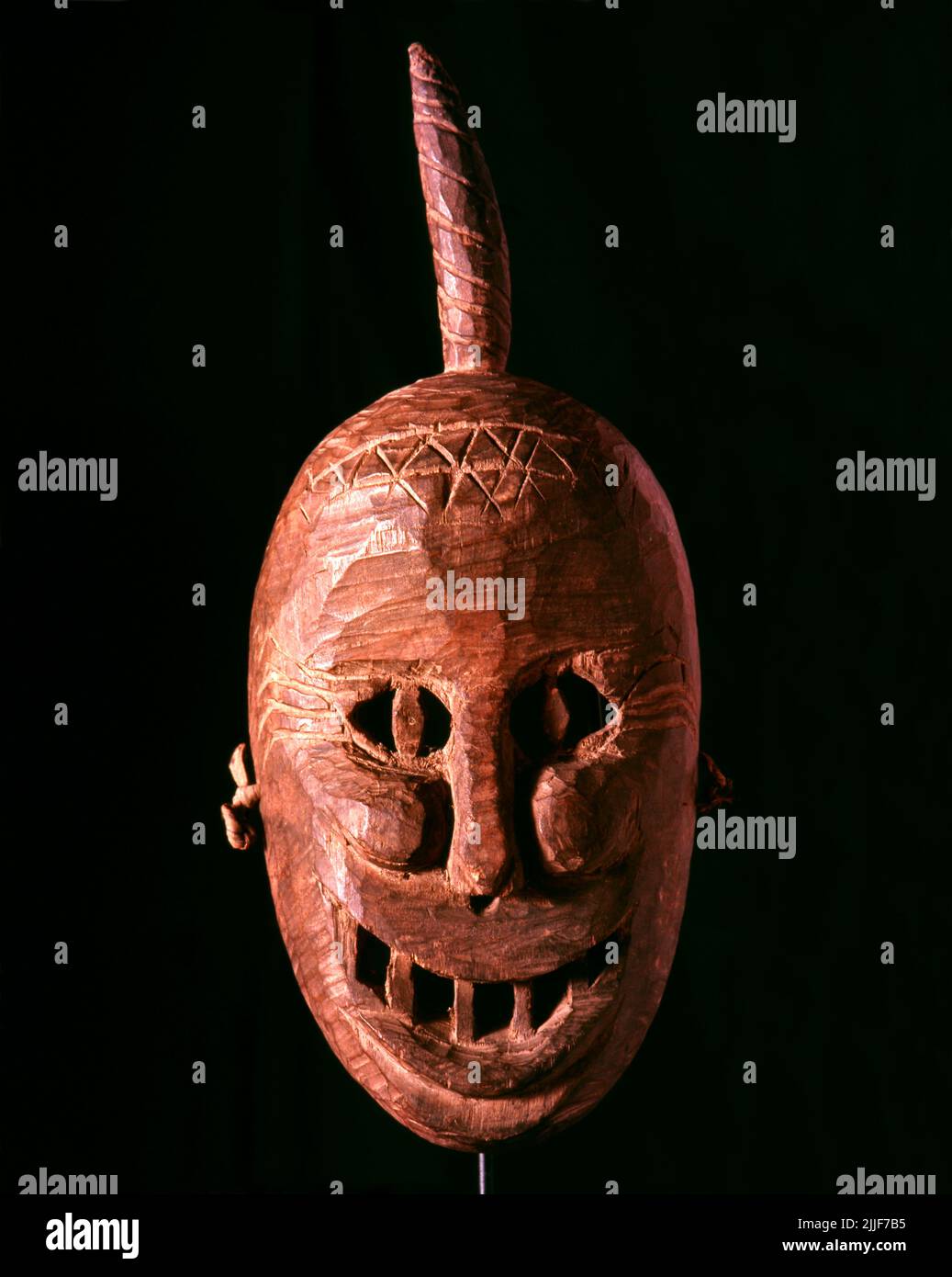 Thailand / China: Yao shaman's mask from northern Thailand. The Yao nationality (its great majority branch is also known as Mien) is a government classification for various minorities in China. They form one of the 55 ethnic minority groups officially recognized by the People's Republic of China, where they reside in the mountainous terrain of the southwest and south. They also form one of the 54 ethnic groups officially recognized by Vietnam. In the last census, they numbered 2,637,421 in China, and roughly 470,000 in Vietnam. In Thailand they number 40,000 and in Laos 20,000. Stock Photo