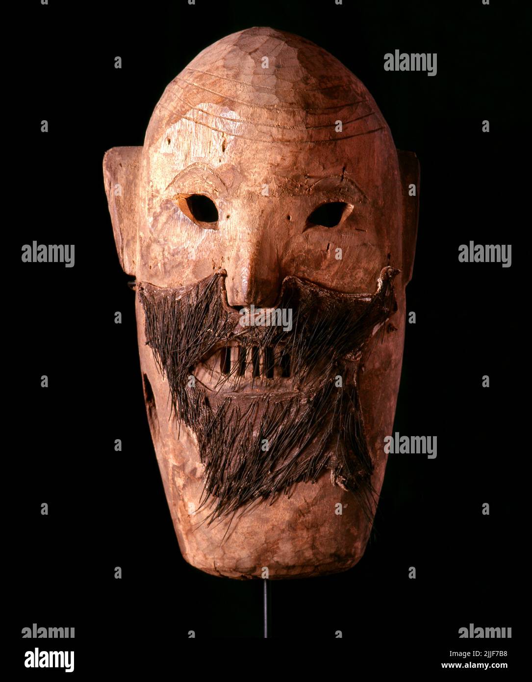 Thailand / China: Yao shaman's mask from northern Thailand. The Yao nationality (its great majority branch is also known as Mien) is a government classification for various minorities in China. They form one of the 55 ethnic minority groups officially recognized by the People's Republic of China, where they reside in the mountainous terrain of the southwest and south. They also form one of the 54 ethnic groups officially recognized by Vietnam. In the last census, they numbered 2,637,421 in China, and roughly 470,000 in Vietnam. In Thailand they number 40,000 and in Laos 20,000. Stock Photo