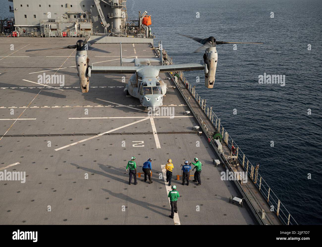 A U.S. Marine Corps MV-22 Osprey assigned to Marine Medium Tiltrotor  Squadron (VMM) 163 lands on the flight deck of USS Hershel 'Woody' Williams  (ESB 4) in the Gulf of Aden, July 13, 2022.  Hershel 'Woody' Williams is on  a scheduled deployment in the U.S. Naval Forces Africa area of operations,  employed by U.S. Sixth Fleet to defend U.S., allied and partner interests.  (U.S. Air Force photo by Senior Airman Bryan Guthrie) Stock Photo