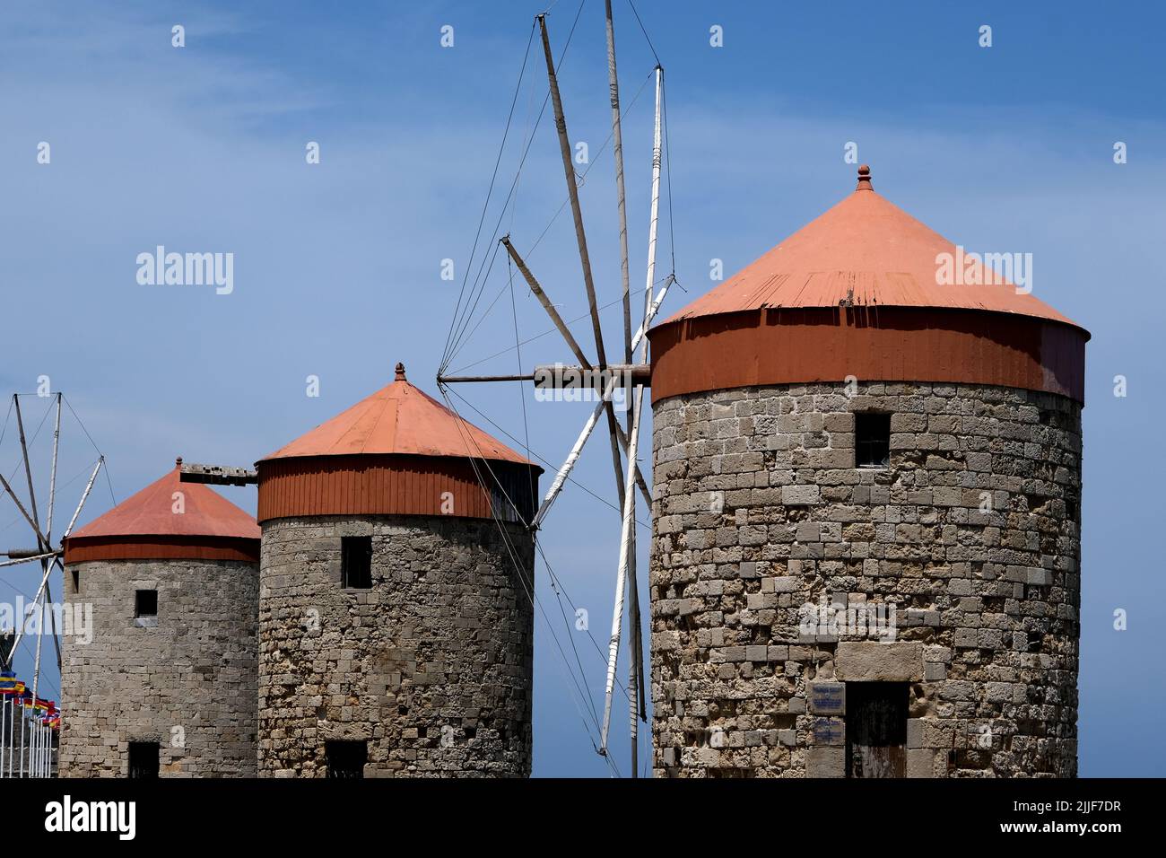 The Windmills of Mandraki in Mandraki Harbour on the island of Rhodes in Greece Stock Photo
