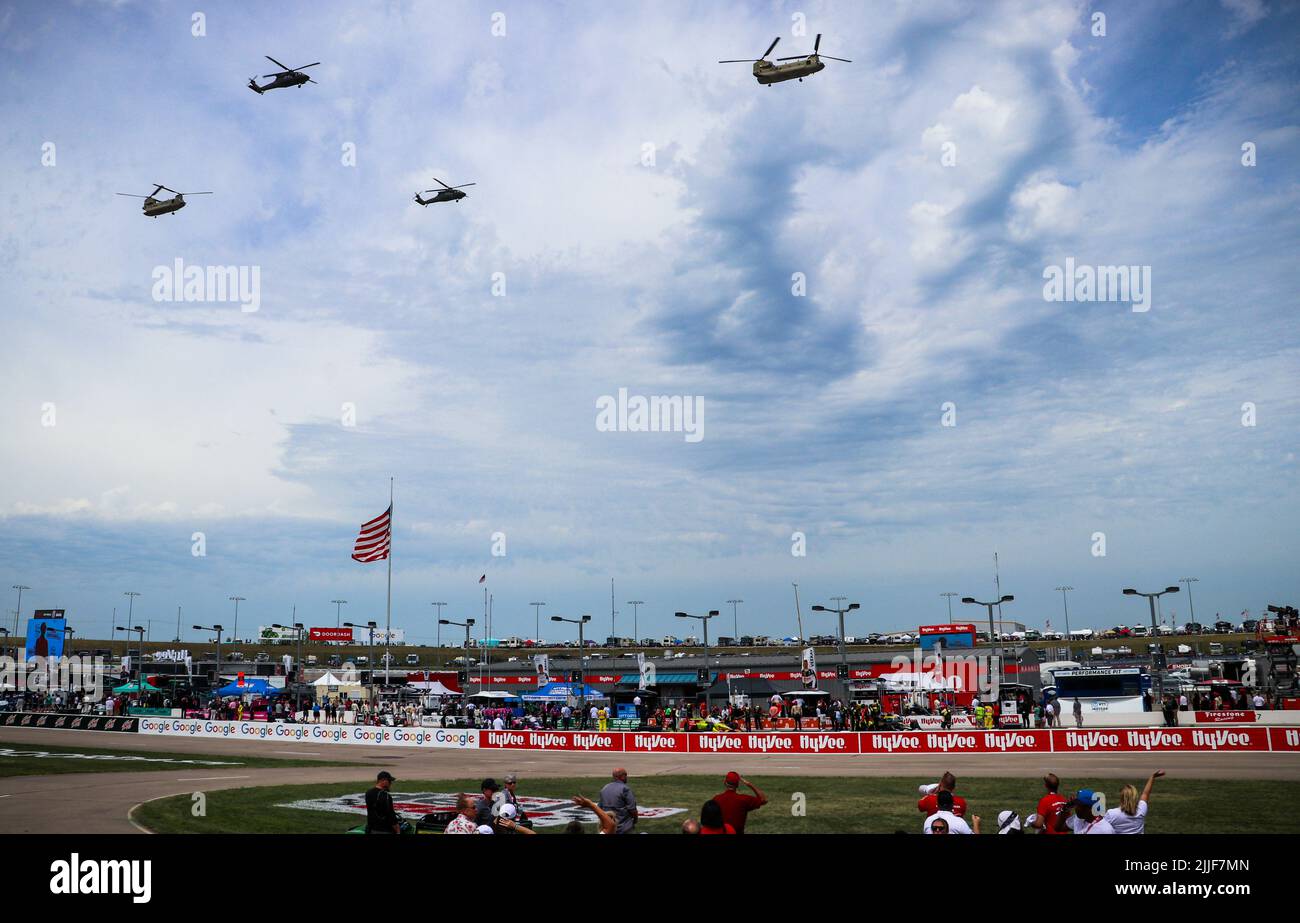 Iowa Army National Guard Soldiers assigned to Company C, 2nd Battalion, 147th Assault Helicopter Battalion and Company B, 1st Battalion, 171st General Support Aviation Battalion, fly over the Iowa Speedway in UH-60 Black Hawks and CH-47 Chinooks on July 23, 2022. The Soldiers flew over after the national anthem was sung. (U.S. Army National Guard photos by Capt. Kevin Waldron) Stock Photo