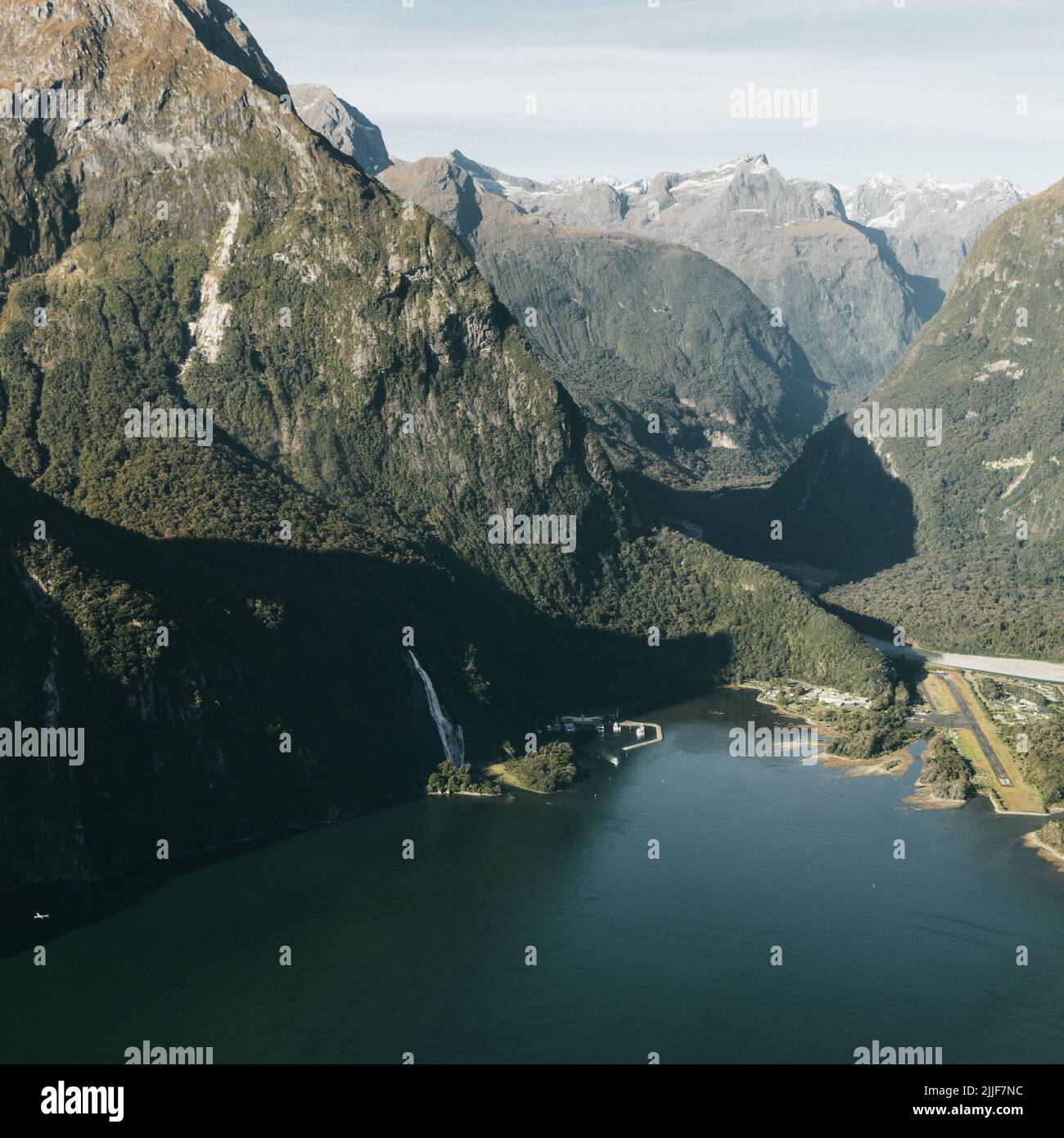 New Zealand. Milford Sound (Piopiotahi) from above - the head of the fiord, Cleddau River and Milford Sound Airport Stock Photo