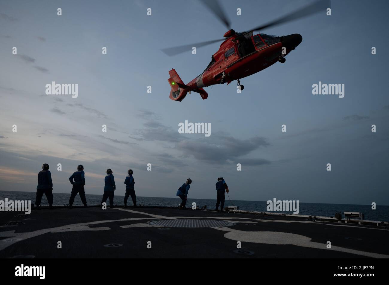 Crew members aboard U.S. Coast Guard Cutter Bear (WMEC 901) send a