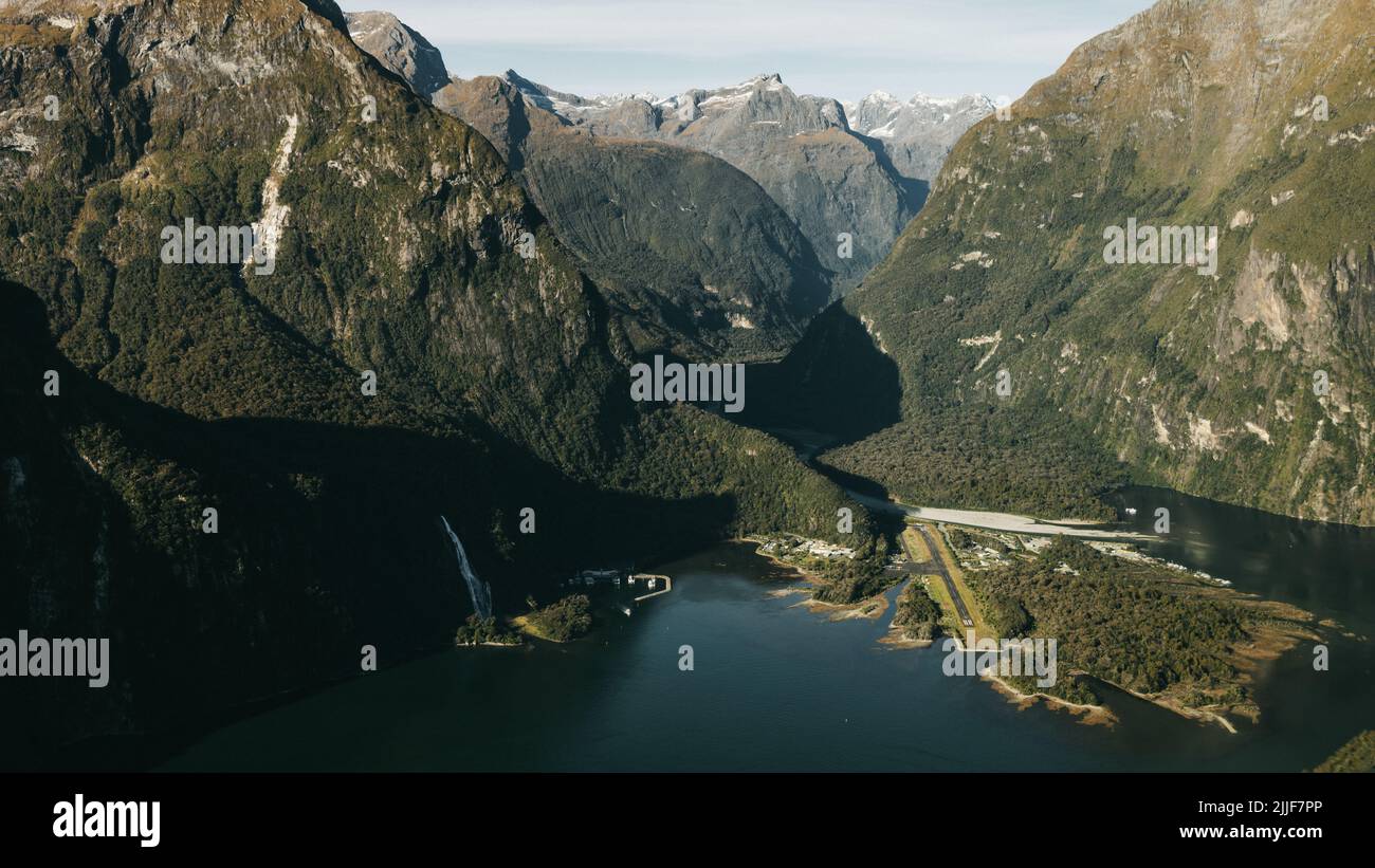 New Zealand. Milford Sound (Piopiotahi) from above - the head of the fiord, Cleddau River and Milford Sound Airport Stock Photo