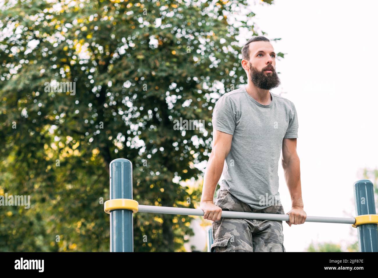 workout exercise man pull ups chest bicep training Stock Photo Alamy