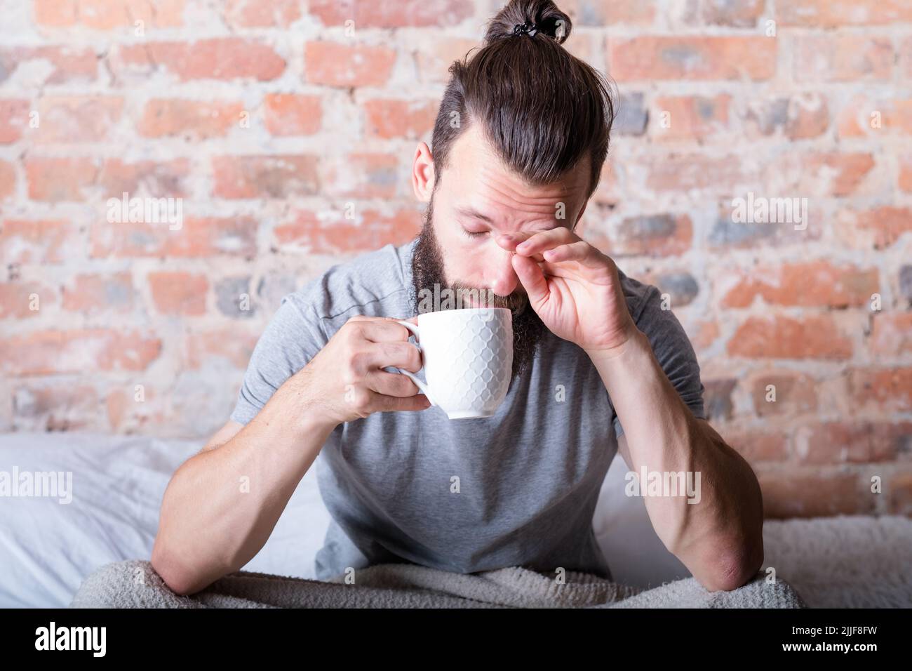 morning laziness man bed sleepy eyes cup Stock Photo Alamy