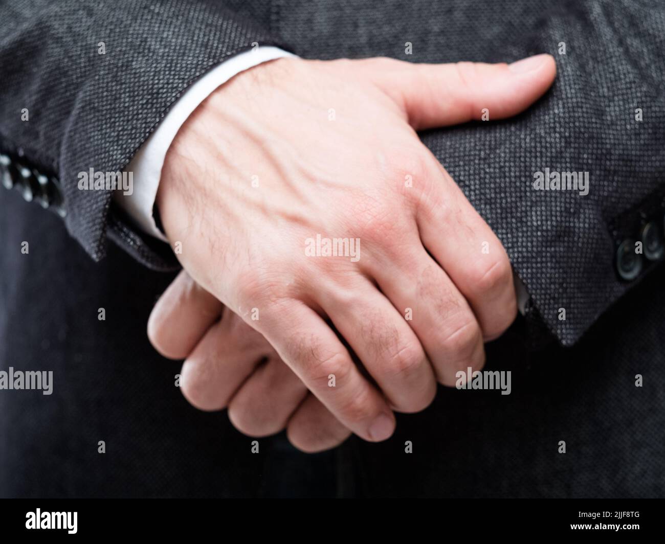 man hands gesture protection defence insecurity Stock Photo