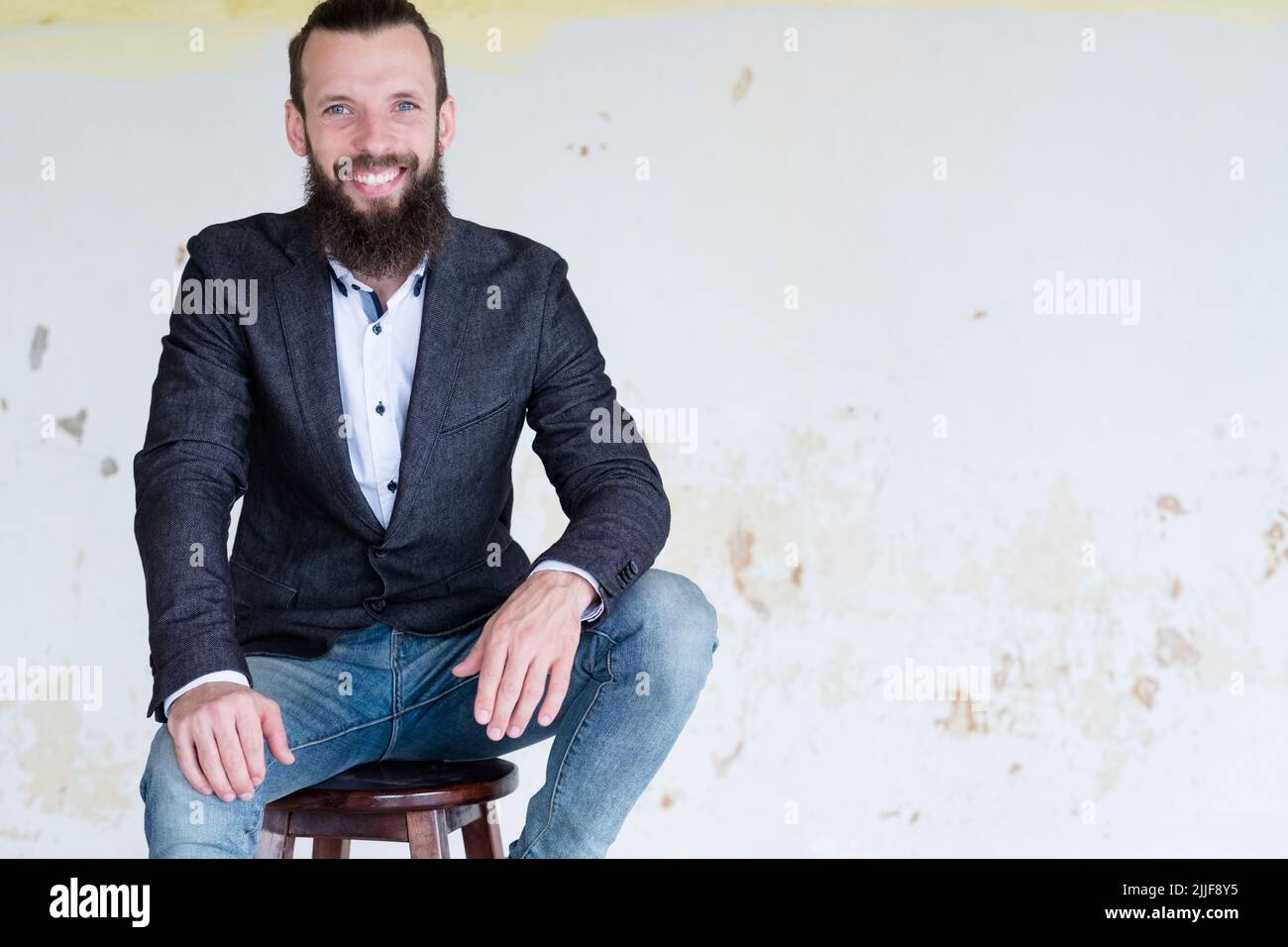 man sitting smart casual business fashion style Stock Photo