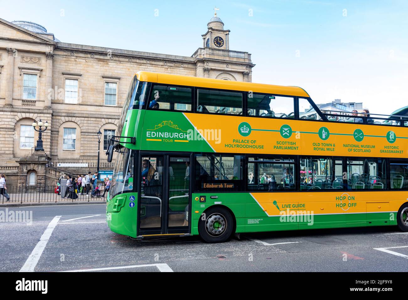 City of Edinburgh Scotland, people on a green and yellow open top sightseeing bus view the sights of Edinburgh,Scotland,UK,summer 2022 Stock Photo