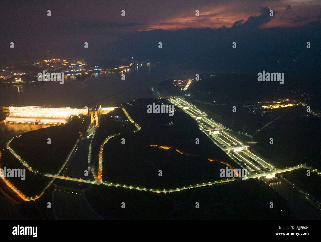 YICHANG, CHINA - JULY 25, 2022 - Aerial photo taken on July 25, 2022 shows ships passing through the five-level lock of the Three Gorges Dam in Yichan Stock Photo
