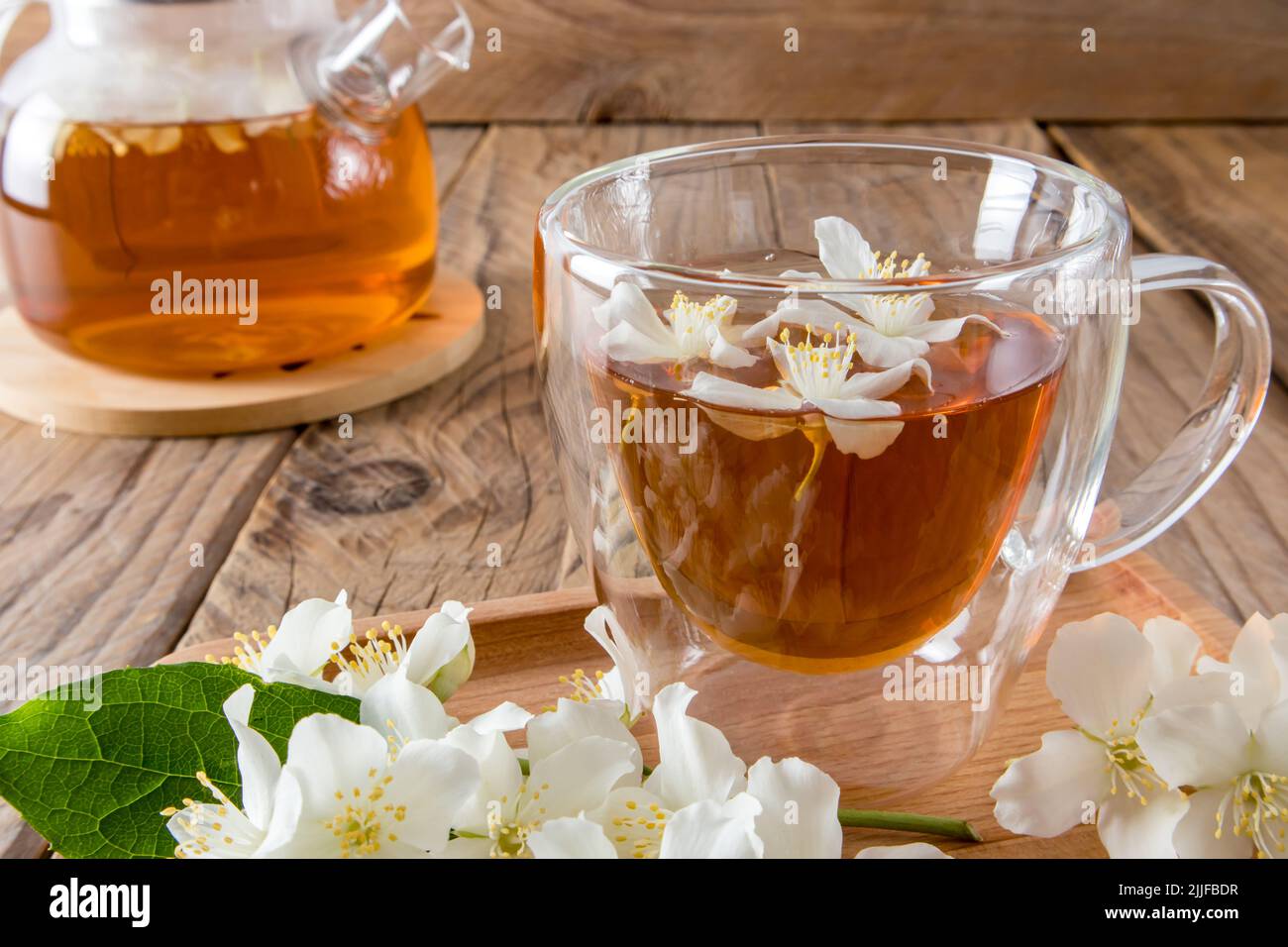 Front View Of Natural Fragrant Jasmine Tea In A Glass Transparent Cup Front View Of Natural Fragrant Jasmine Tea In A Glass Transparent Cup