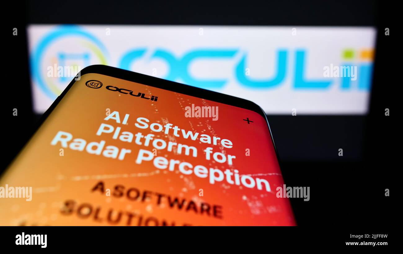 Mobile phone with website of US radar technology company Oculii on screen in front of business logo. Focus on top-left of phone display. Stock Photo