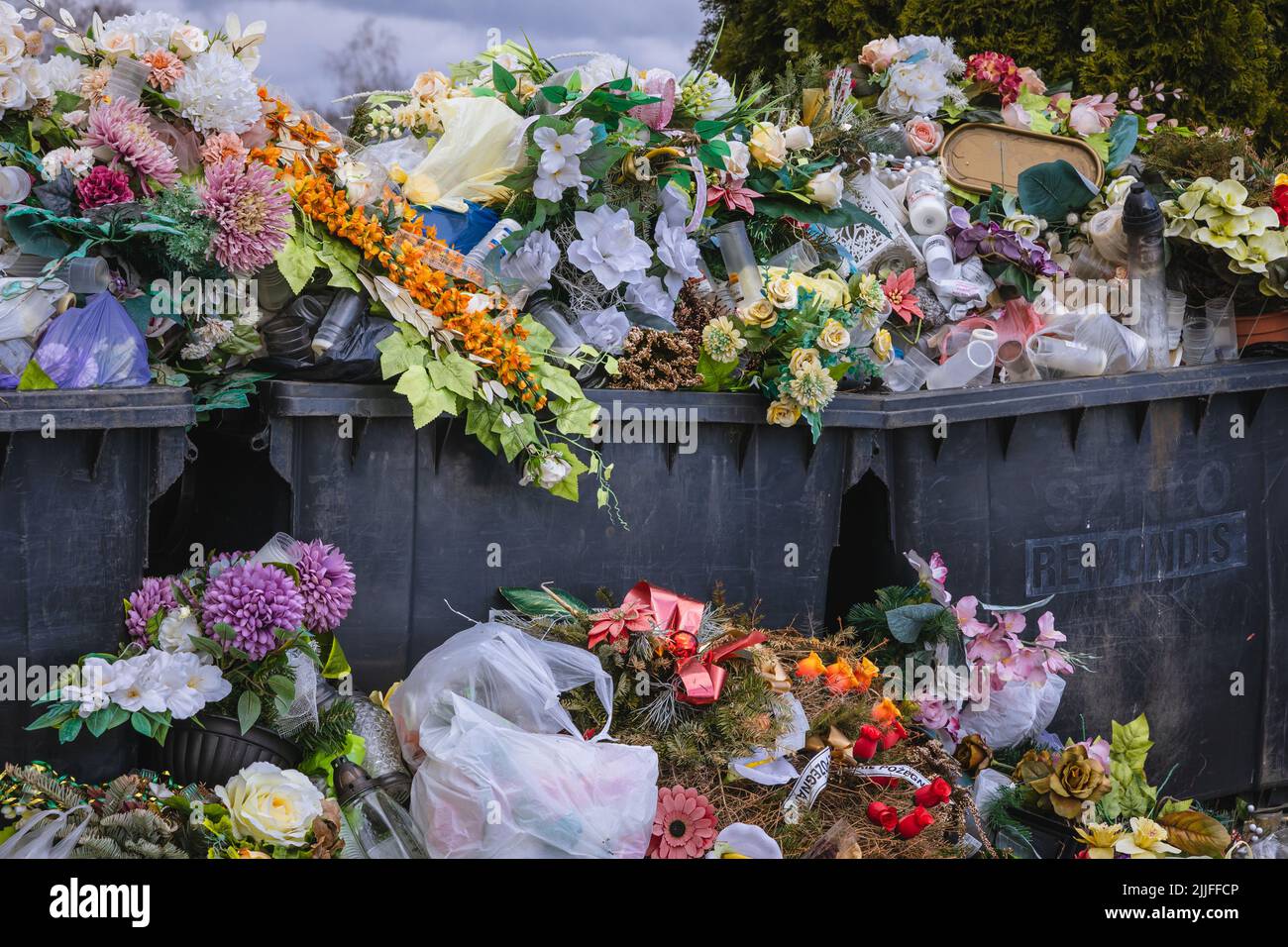 Dumpsters next to cemetery in Rogow village in Lodzkie Voivodeship of Poland Stock Photo