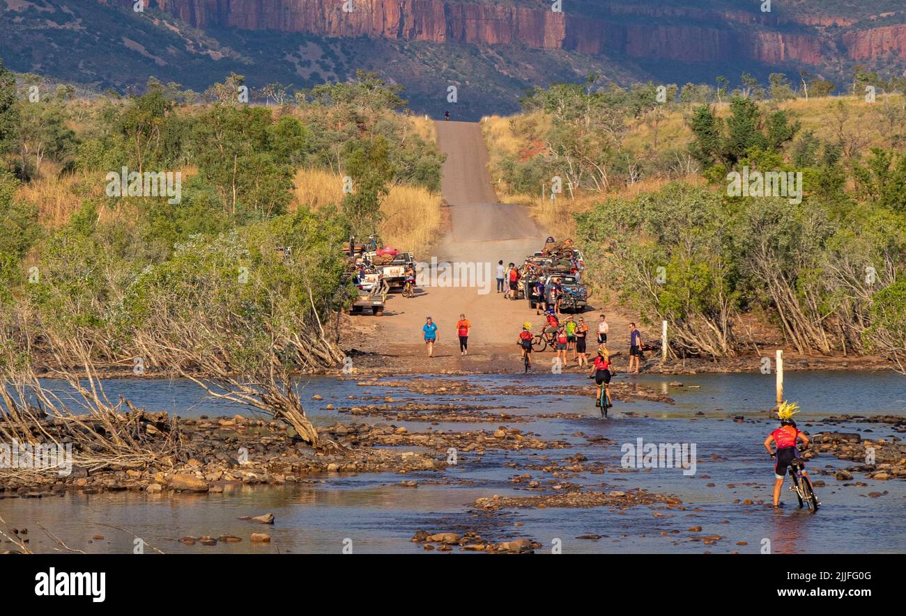 Gibb Challenge 2022 charity bike ride along Gibb River Road crossing the Pentecost River Kimberley Western Australia Stock Photo