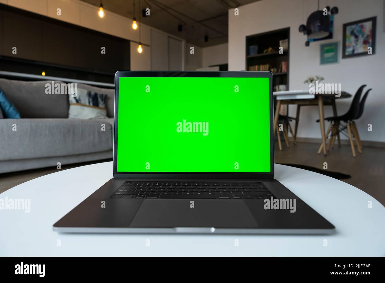 Mockup image of laptop computer with green screen chromakey for advertising app. Stock Photo