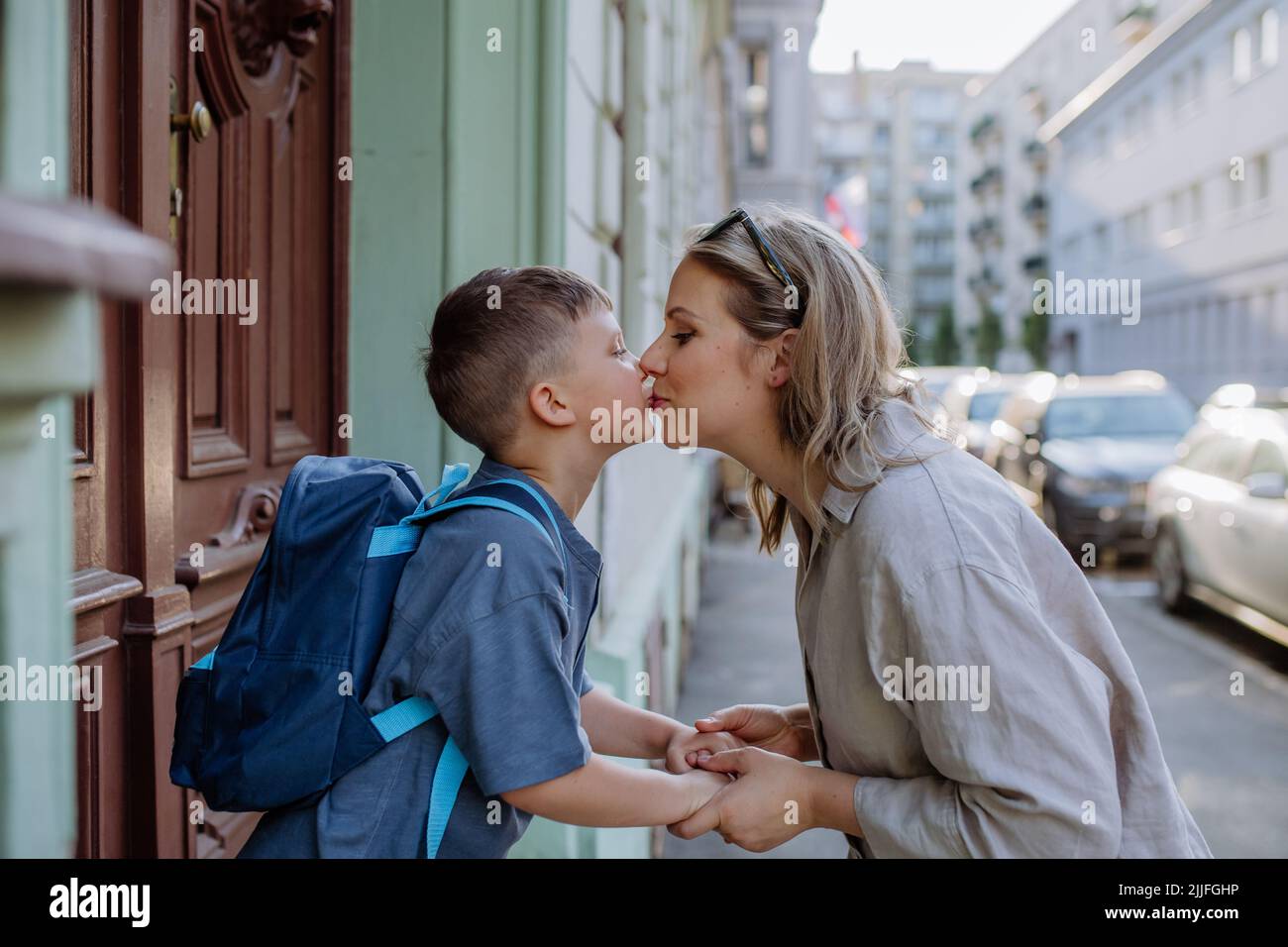 Mother kissing child goodbye at school hires stock photography and images Alamy