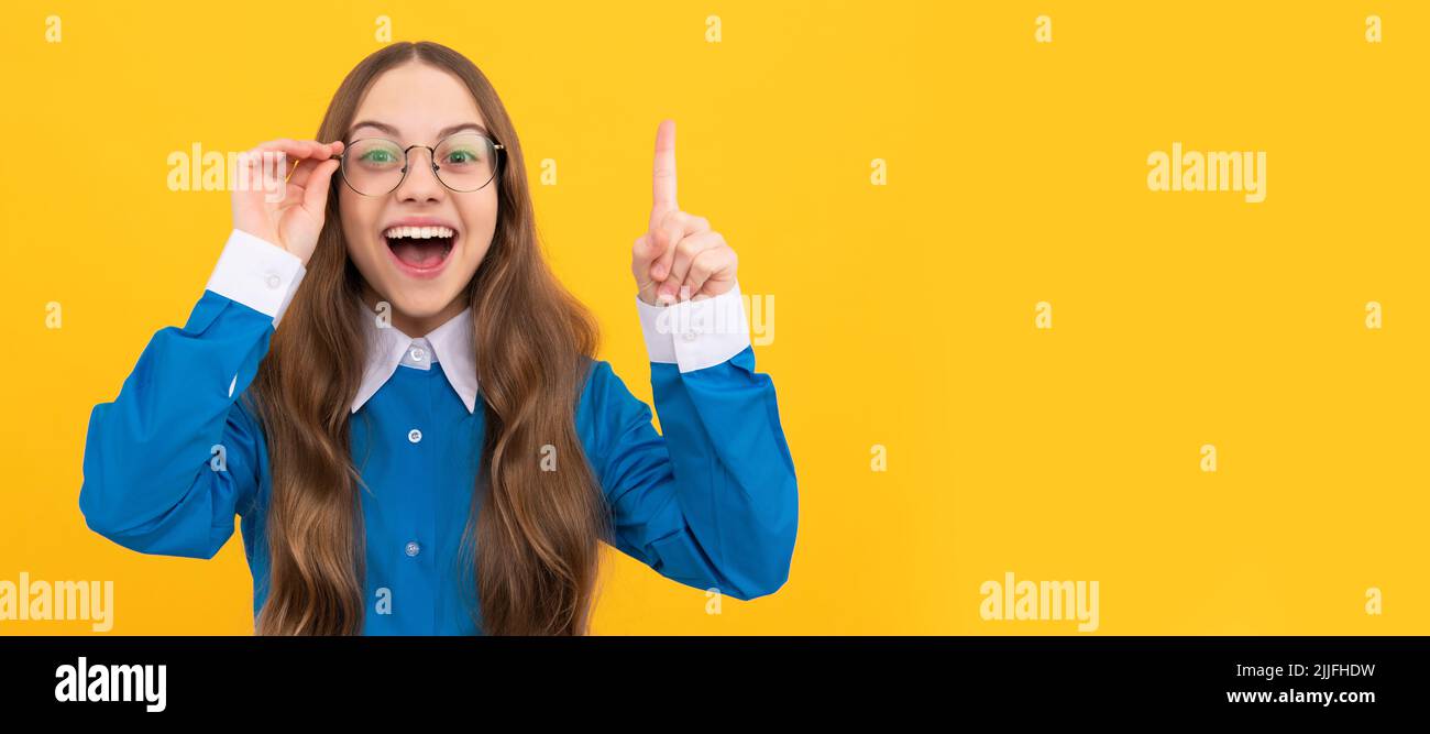 Genius idea. Girl genius with raised finger. Child prodigy in