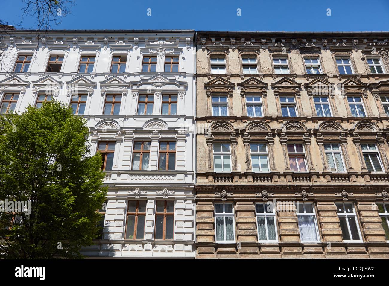 Comparison of facade renovation before and after on an old building facade in Berlin Stock Photo