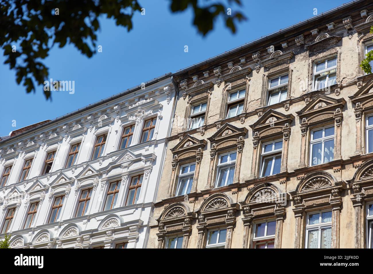 Old facade of old building before and after renovation for comparison in Berlin Stock Photo