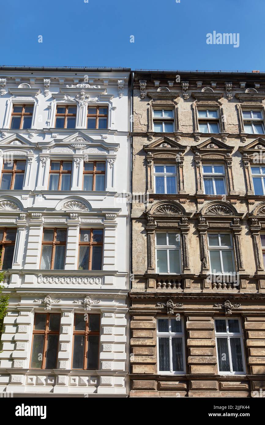New and old facades on old buildings before and after energy-related renovation Stock Photo
