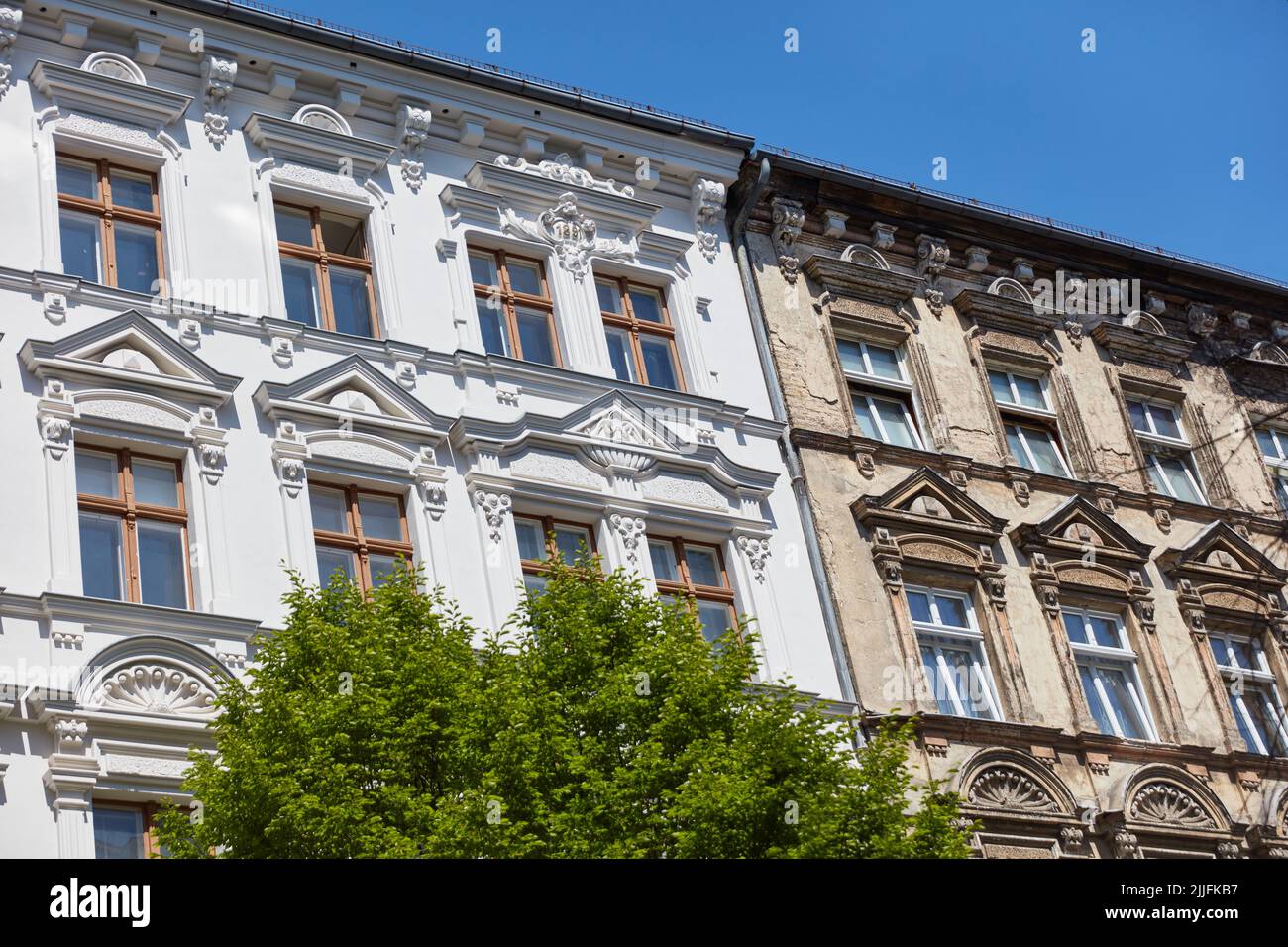 Façade renovation on old buildings with insulation before and after comparison Stock Photo
