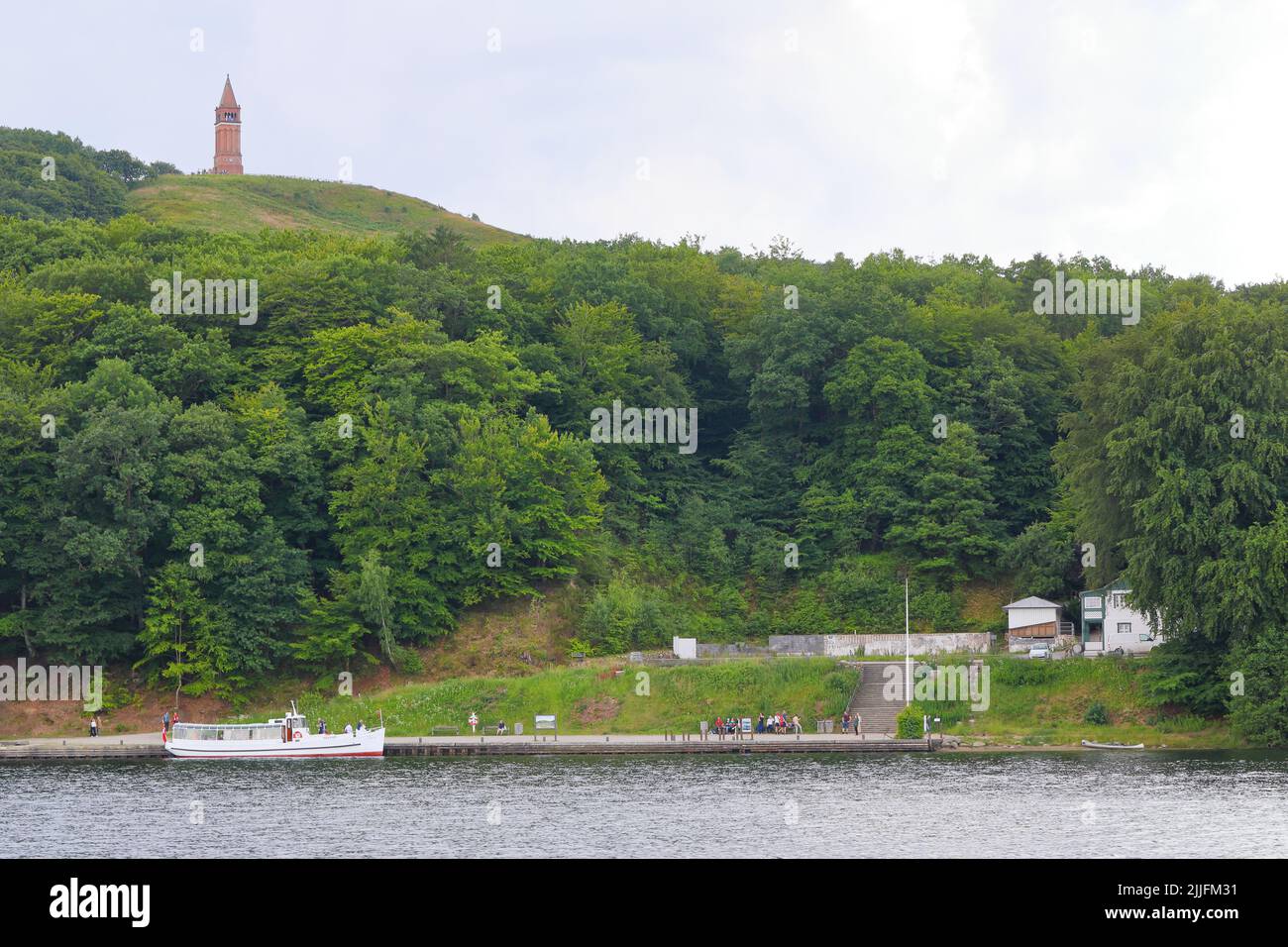 Himmelbjerget,, the hill that was once believed to be the tallest point in Denmark as seen from Julsø with Hotel Julsø in the foreground in 2022. Stock Photo