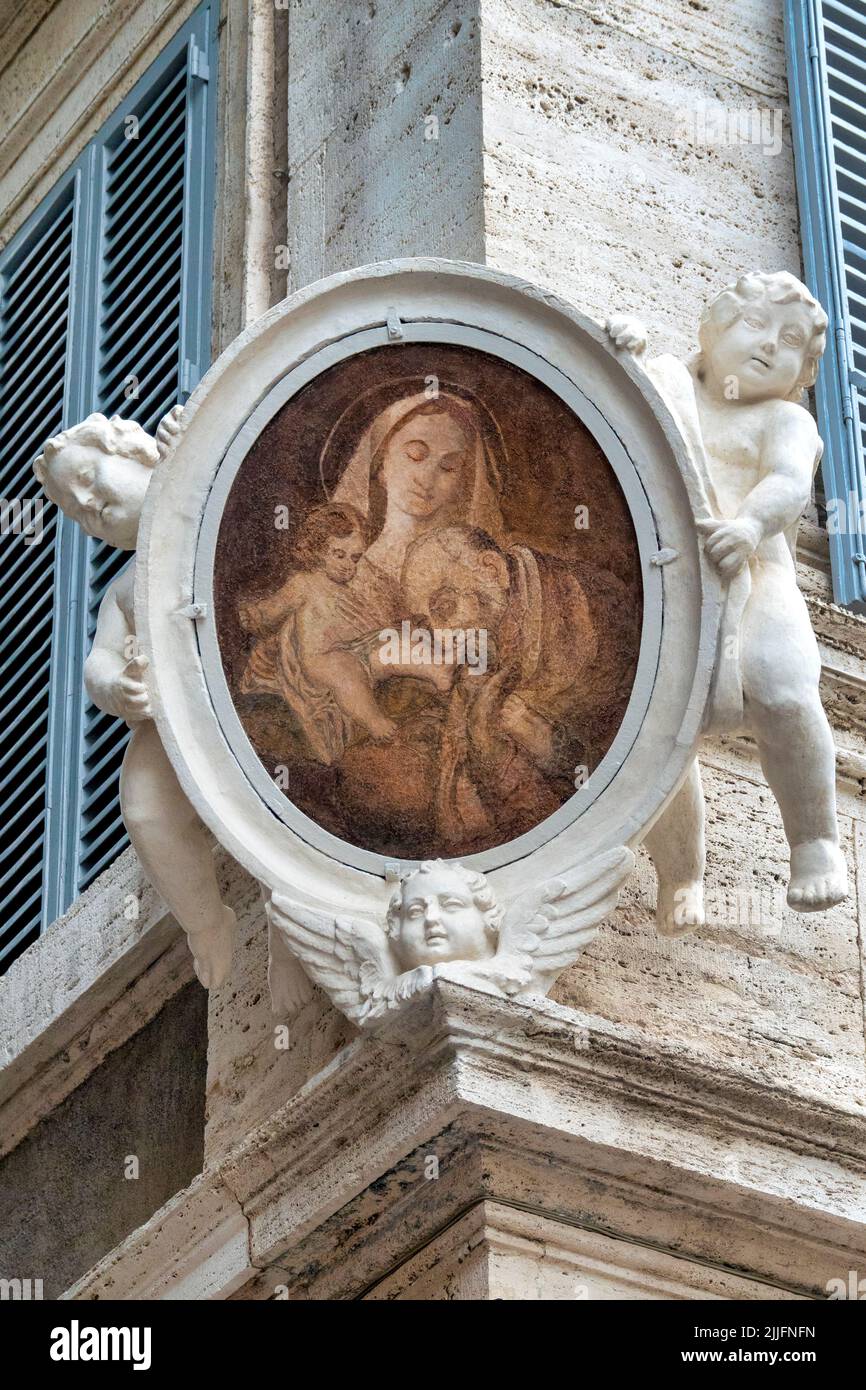 Madonna col bambino and Saint Filippo Neri in the corner between Via di Monserrato e Via dei Farnesi, Rome, Italy Stock Photo