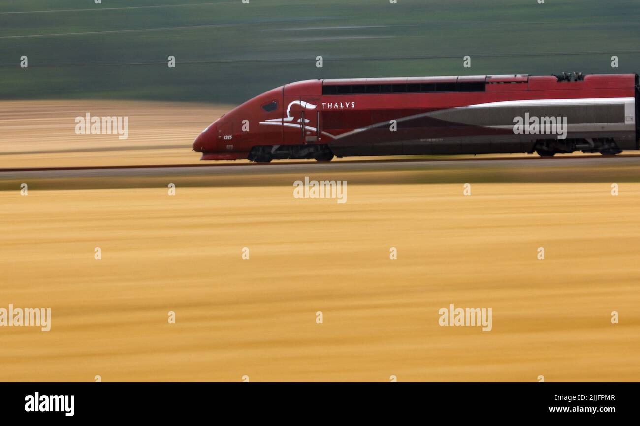 A Thalys high-speed train speeds on the LGV Nord rail track outside Rully near Paris, France, July 26, 2022. REUTERS/Gonzalo Fuentes Stock Photo