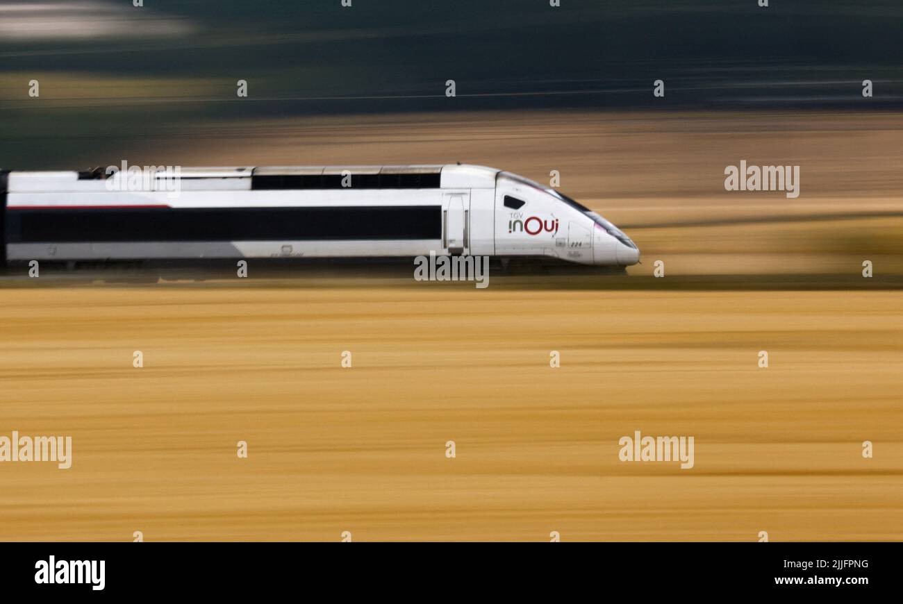 A TGV InOui high-speed train operated by state-owned railway company SNCF speeds on the LGV Nord rail track outside Rully near Paris, France, July 26, 2022. REUTERS/Gonzalo Fuentes Stock Photo